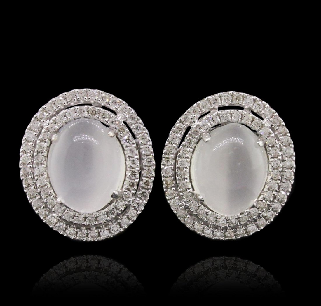 14KT White Gold 3.79ctw Moonstone and Diamond Earrings: 14KT White Gold 3.79ctw Moonstone and Diamond Earrings A8730. New Condition! DU308DV. One electronically tested 14KT white gold lady's combination cast & assembled pendant with a bright polish finish.