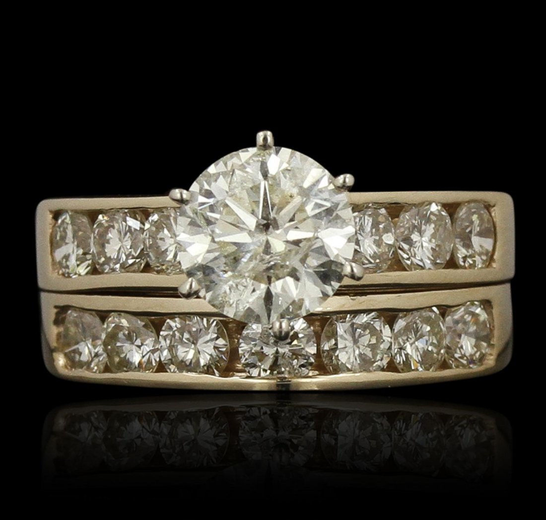 14KT Yellow Gold 1.60ct I-1/M Diamond Wedding Ring Set: 14KT Yellow Gold 1.60ct I-1/M Diamond Wedding Ring Set GB3508. Good Condition! GW7574SY. One electronically tested 14KT yellow gold ladies cast & assembled diamond wedding set. Condition is good. The