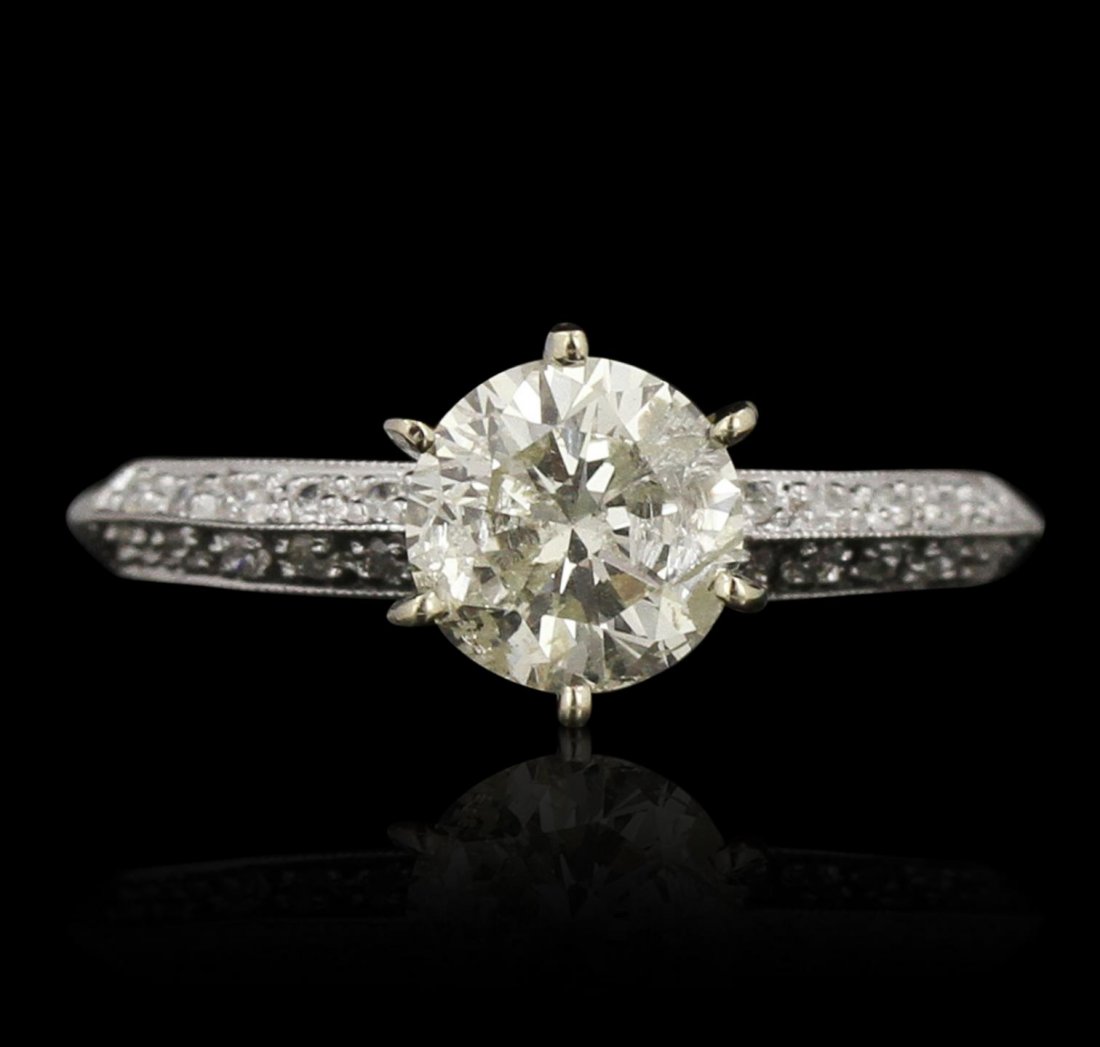 18KT White Gold 1.10ct I-1/M Diamond Ring GB3526: 18KT White Gold 1.10ct I-1/M Diamond Ring GB3526. Good Condition! ZV2572ZN. One electronically tested 18KT white gold ladies cast & assembled diamond unity ring. Condition is good. The featured diamon