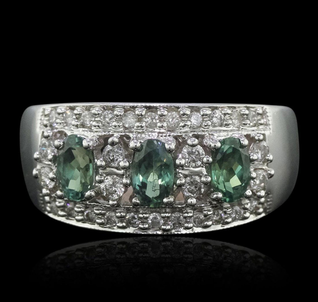 14KT White Gold 0.84ctw Alexandrite and Diamond Ring: 14KT White Gold 0.84ctw Alexandrite and Diamond Ring CRJ298. Good Condition! FD756KF. One ring featuring: 14KT gold with a total weight of 6.17 grams, (3) alexandrites with a total weight of 0.84ctw,