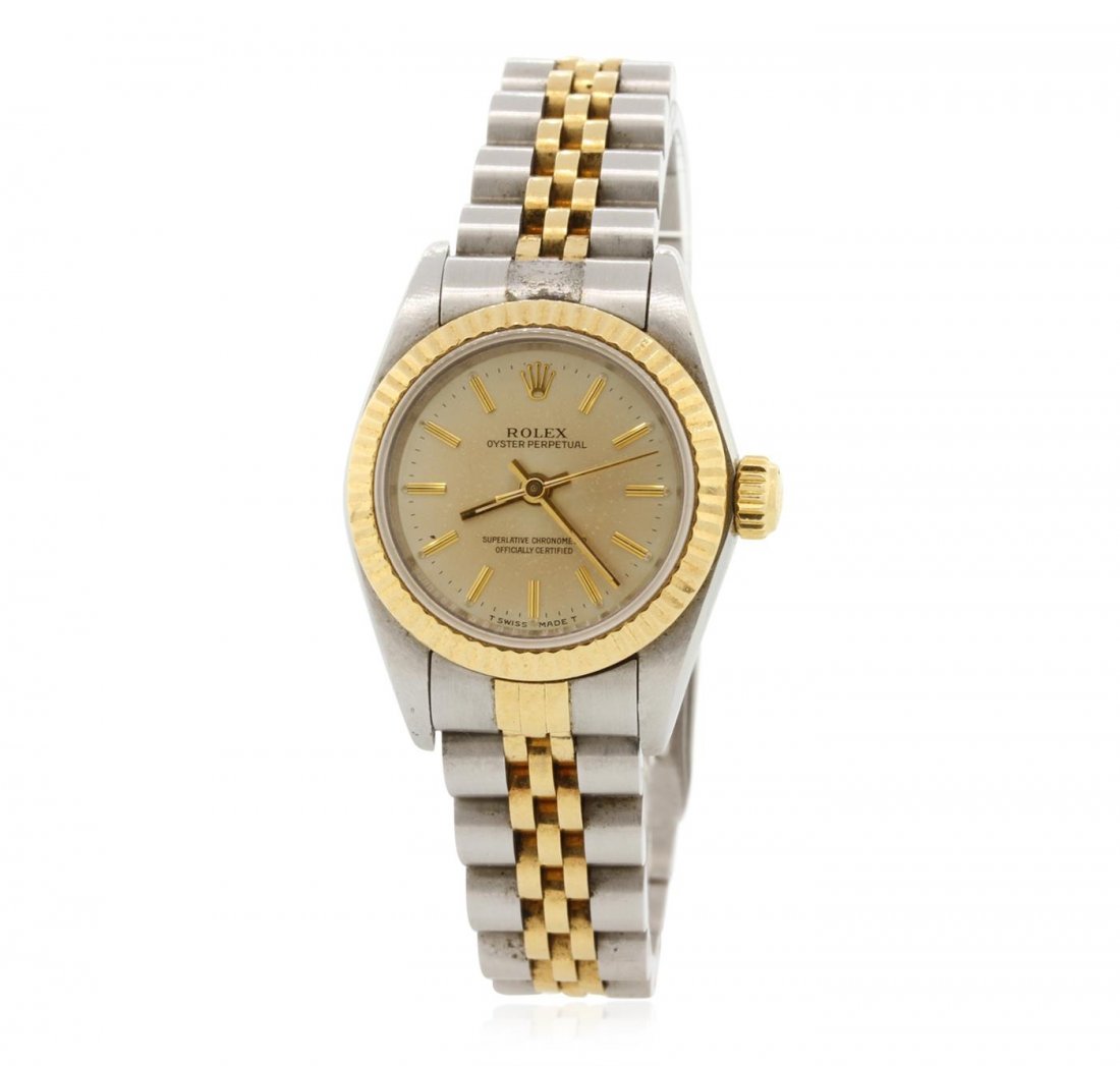Ladies Rolex Oyster Perpetual Two Tone Wristwatch: One ladies, hand crafted & machine milled Rolex Oyster Perpetual Model wristwatch electronically tested, Stainless Steel Case: 25mm oyster, 18KT yellow gold Crown: twinlock with logo, Bezel: 18KT yell