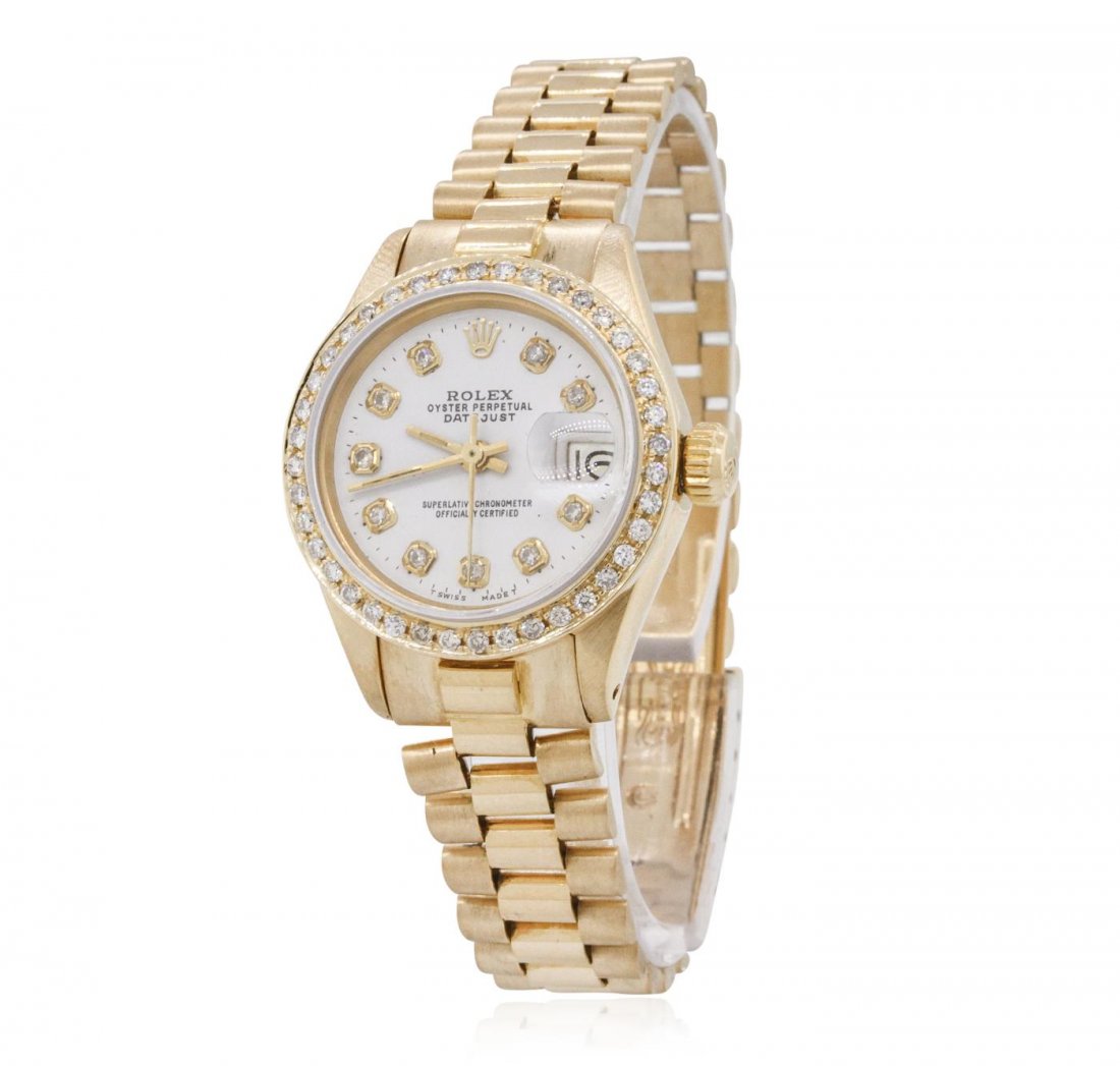 Ladies Rolex 18KT Yellow Gold Diamond DateJust: One ladies, hand crafted & machine milled Rolex DateJust model wristwatch electronically tested 18KT yellow gold, Circa: early 1970, Case: 26mm oyster, Crown: twinlock with logo, Custom Bezel: diamond