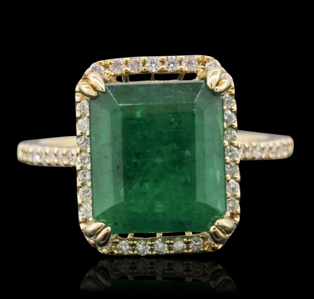 14KT Yellow Gold 2.59ct Emerald and Diamond Ring: One electronically tested 14KT yellow gold ladies combination cast & assembled ring with a bright polish finish. Condition is new. Identified with markings of "14K". Containing: One prong set emerald 