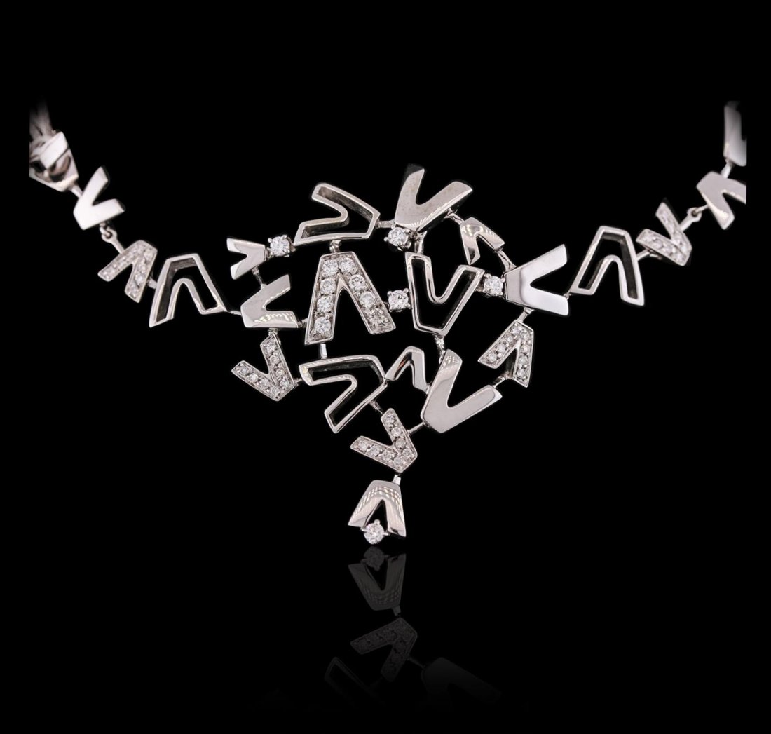 18KT White Gold 1.04ctw Diamond Versace Bracelet: One electronically tested 18KT white gold ladies combination cast & assembled Versace bracelet with a bright polish finish. Measurements: 6" in length. Trademark is VERSACE. Condition is new. Containi