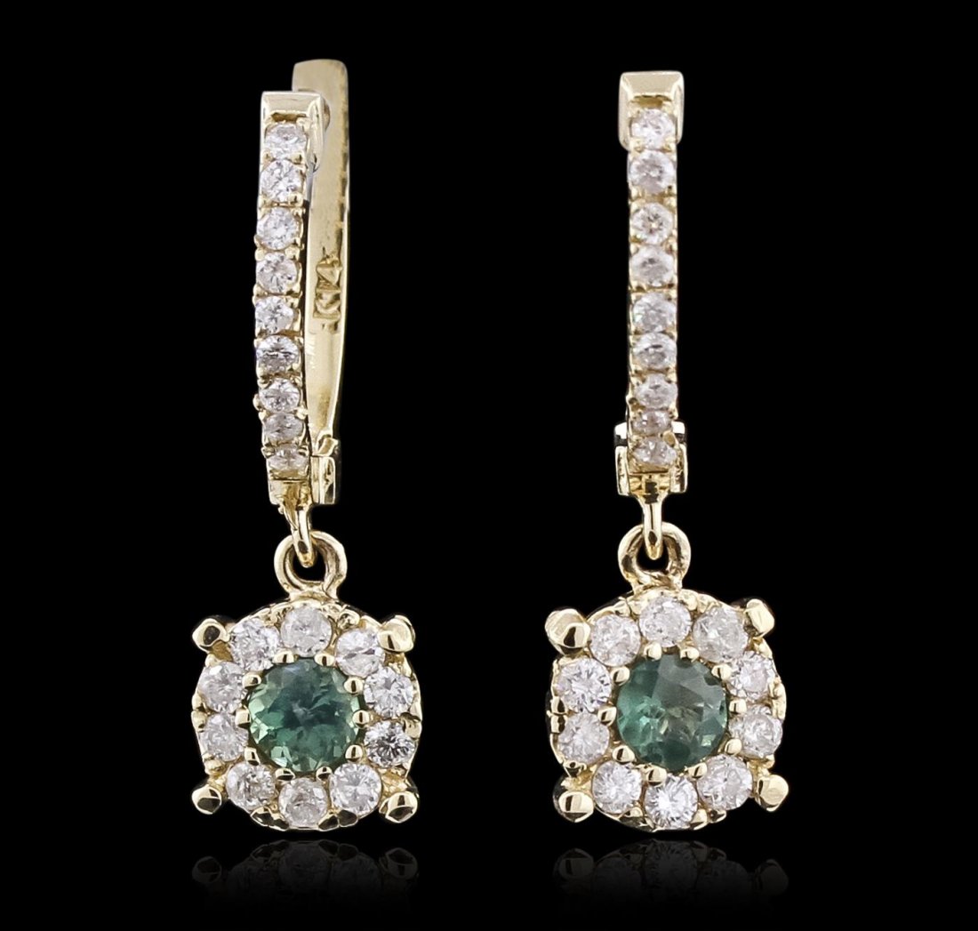 14KT White Gold 0.42ctw Alexandrite and Diamond: One pair of earrings featuring: 3.17 grams of 14KT white gold, alexandrite with a total weight of 0.42cts, round diamonds with a total weight of 0.53cts.