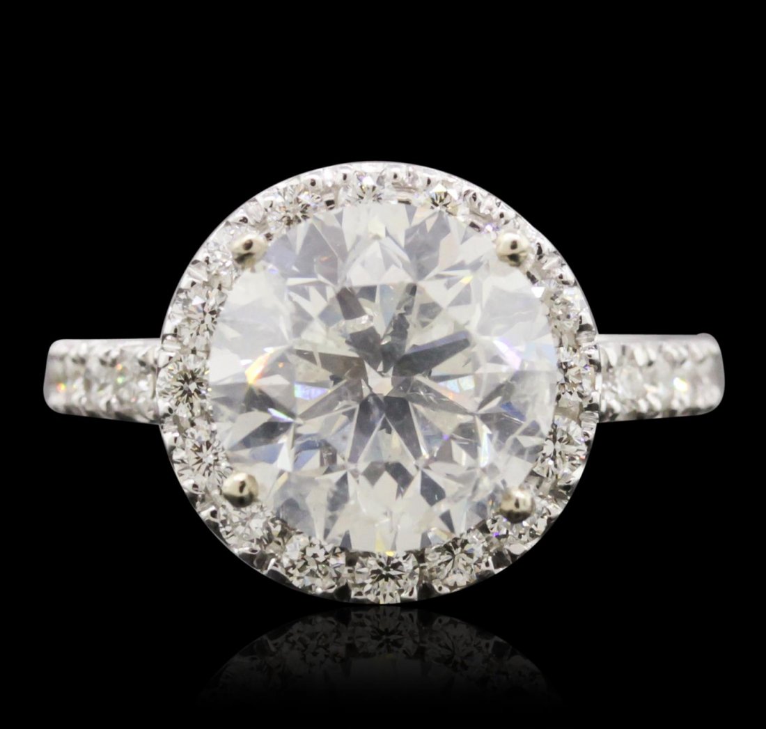 14KT White Gold 5.02ct EGL Certified Brilliant Cut: One electronically tested 14KT white gold ladies cast diamond unity ring with a bright polish finish. Condition is new, good workmanship. The featured diamond is set within a diamond bezel supported b
