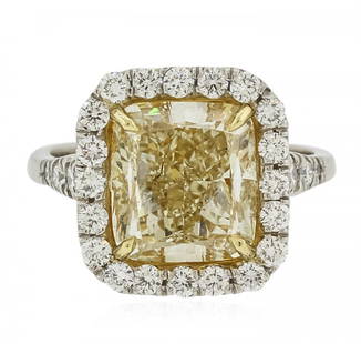 Platinum and 18KT Yellow Gold EGL Certified 6.21ctw: One electronically tested platinum and 18KT yellow gold ladies cast diamond ring with a bright polish finish. The featured diamond is set within a diamond bezel supported by diamond set shoulders, com