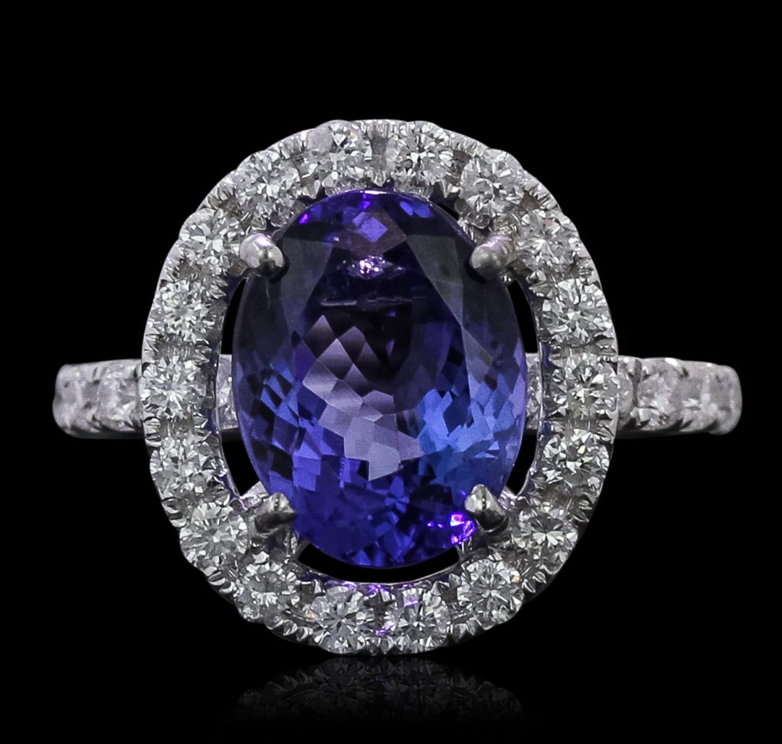 14KT White Gold 3.35ct Tanzanite and Diamond Ring: One electronically tested 14KT white gold Ladies combination cast & assembled ring with a bright polish finish. Condition is new. Identified with markings of "14K". Containing: One prong set oval modi