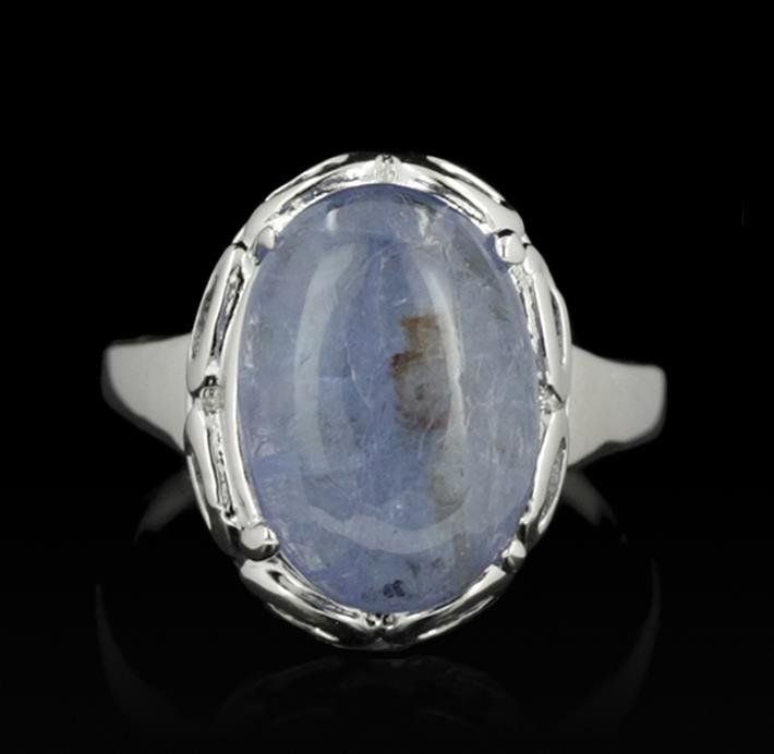 SILVER 5.19ct Tanzanite Ring: One electronically tested 925 silver ladies cast tanzanite solitaire ring with a bright polish finish. The featured tanzanite is supported by a lattice under gallery, completed by a one and one-half m