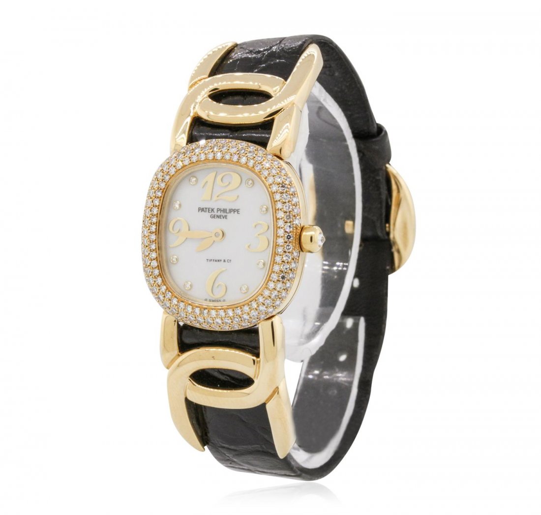 Ladies Patek Philippe 18KT Yellow Gold Golden Ellipse: One ladies, Patek Philippe Golden Ellipse wristwatch electronically tested 18KT yellow gold, Elliptical Case: 24 x 23mm, Case Back: secured with four set screws, Case Lugs: hinged and intertwined, Bez