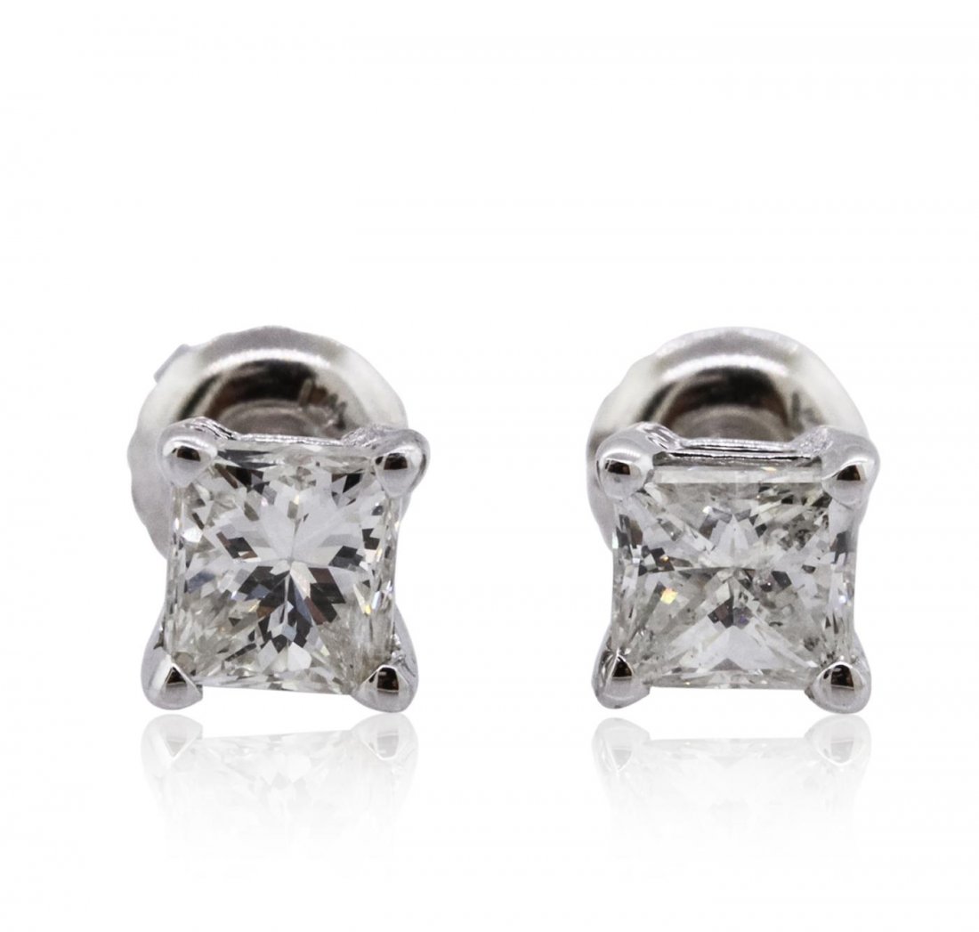 14KT White Gold 1.13ctw Diamond Solitaire Earrings: One pair electronically tested 14KT white gold cast & assembled diamond solitaire earrings with screw backs. Bright polish finish. Condition is new, good workmanship. Containing: One prong set princes