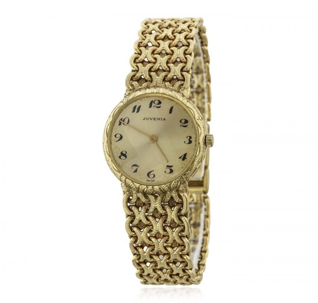 Ladies 18KT Yellow Gold Juvenia Wristwatch: One Juvenia wristwatch featuring: 18KT yellow gold band, jeweler's clasp, case, lugs, and crown, mother of pearl dial with analog display, yellow gold minute and hour hands, Juvenia marker at 12 o'clo