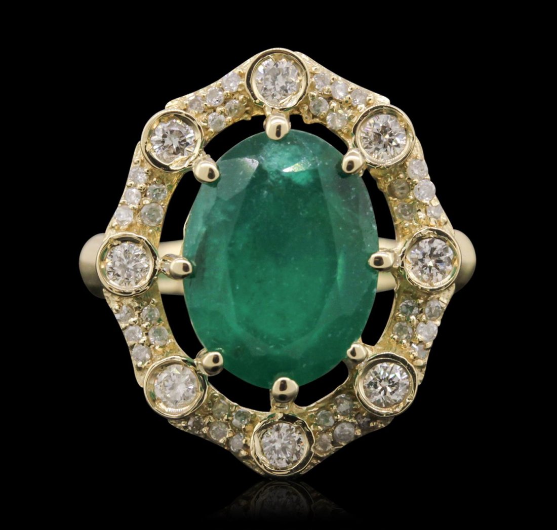14KT Yellow Gold 2.44ct Emerald and Diamond Ring: One electronically tested 14KT yellow gold Ladies combination cast & assembled ring with a bright polish finish. Condition is new. Identified with markings of "K14". Containing: One prong set oval mod