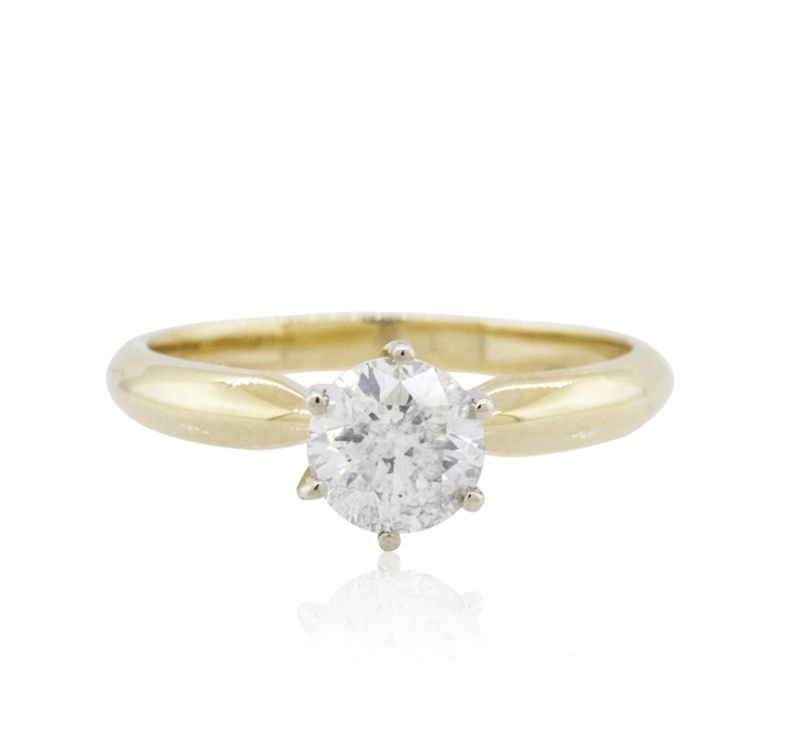 14KT Yellow Gold 0.96ct Brilliant Cut Diamond Solitaire: One electronically tested 14KT yellow gold ladies cast diamond solitaire ring with a bright polish finish. The ring is completed by a two millimeter wide band. Identified with markings of "14K". Condi