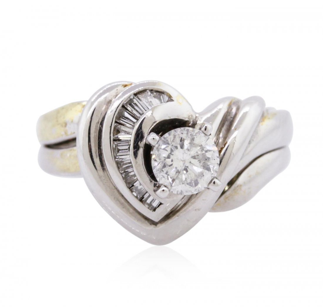 14KT White Gold 0.65ctw Diamond Wedding Ring Set: One wedding ring set featuring: 14KT white gold weighing 8.50 grams containing one round diamond center stone with a total weight of 0.55ct and 10 baguette diamonds with a total weight of 0.10cts.