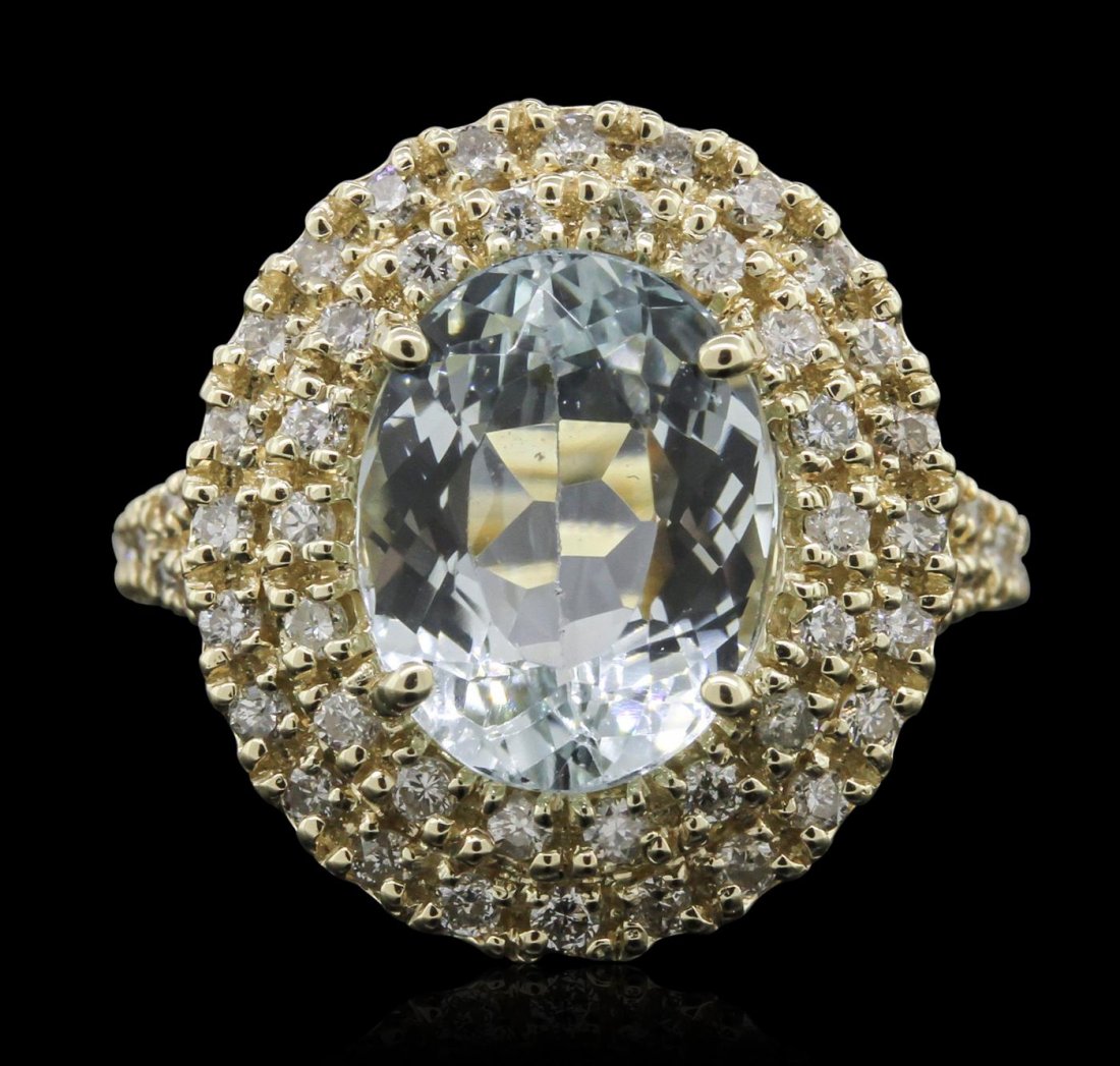 14KT Yellow Gold 3.26ct Aquamarine and Diamond Ring: One electronically tested 14KT yellow gold ladies cast aquamarine and diamond ring with a bright polish finish. Condition is new, good workmanship. The featured aquamarine is set within a two tiered d