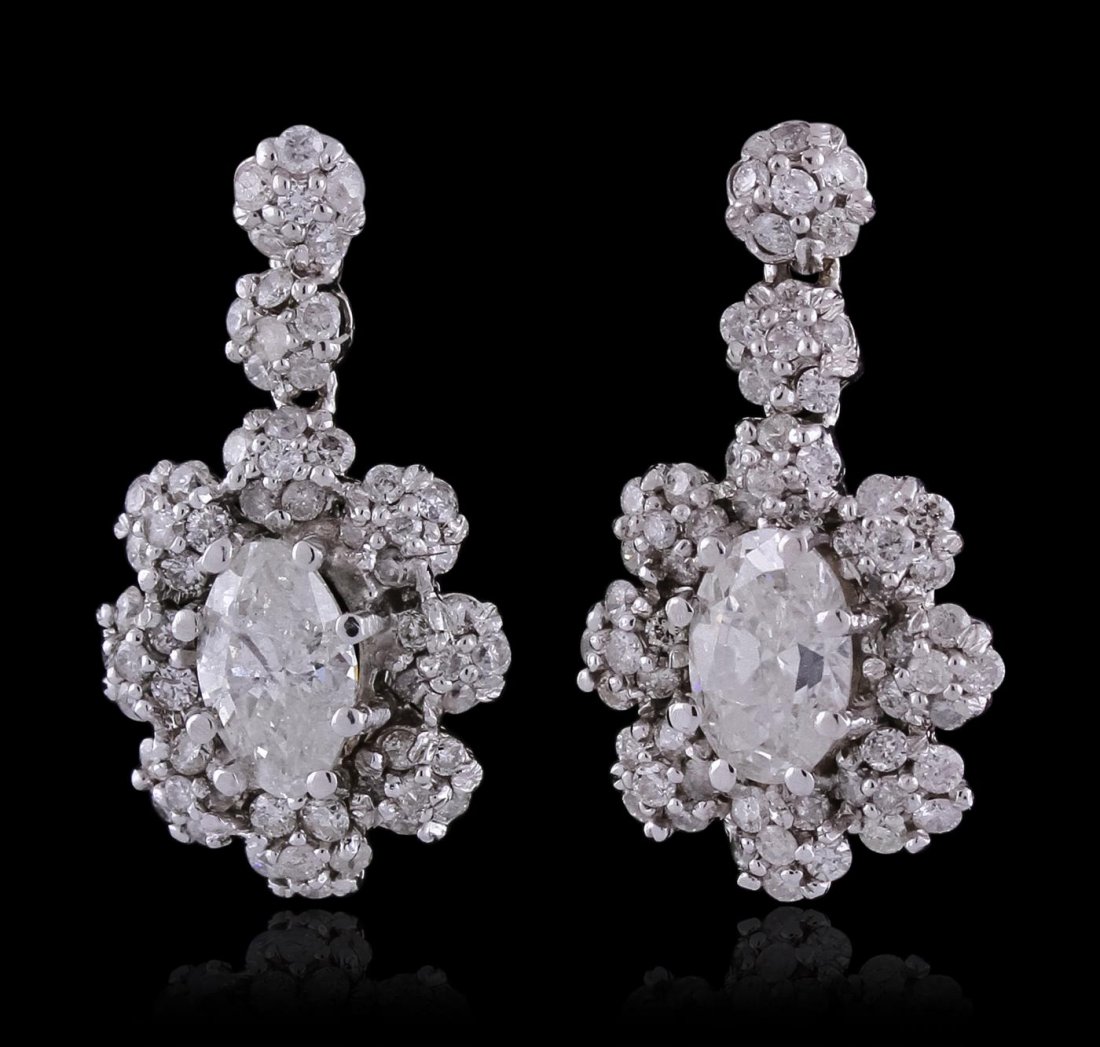 14KT White Gold 2.45ctw Diamond Earrings: One pair electronically tested 14KT white gold ladies cast & assembled diamond dangle earrings with standard backs. Bright polish finish. Condition is new, good workmanship. Containing: Two prong set 