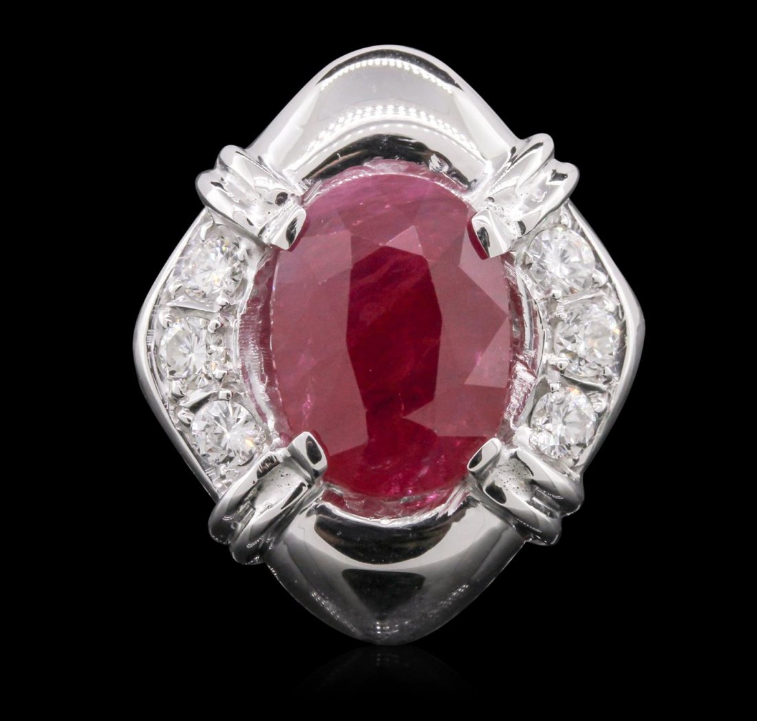 14KT White Gold 5.76ct Ruby and Diamond Ring: One electronically tested 14KT white gold Ladies combination cast & assembled ring with a bright polish finish. Condition is new. Identified with markings of "14K". Containing: One prong set oval modi