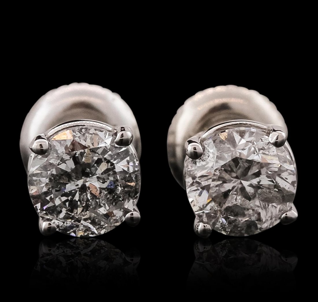 14KT White Gold 1.66ctw Diamond Solitaire Earrings: One pair electronically tested 14KT white gold cast & assembled diamond solitaire earrings with standard backs. Bright polish finish. Condition is new, good workmanship. Containing: One prong set roun