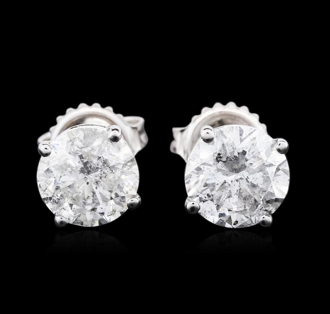14KT White Gold 3.10ctw Diamond Solitaire Earrings: One pair electronically tested 14KT white gold cast & assembled diamond solitaire earrings with standard backs. Bright polish finish. Condition is new, good workmanship. Containing: One prong set roun