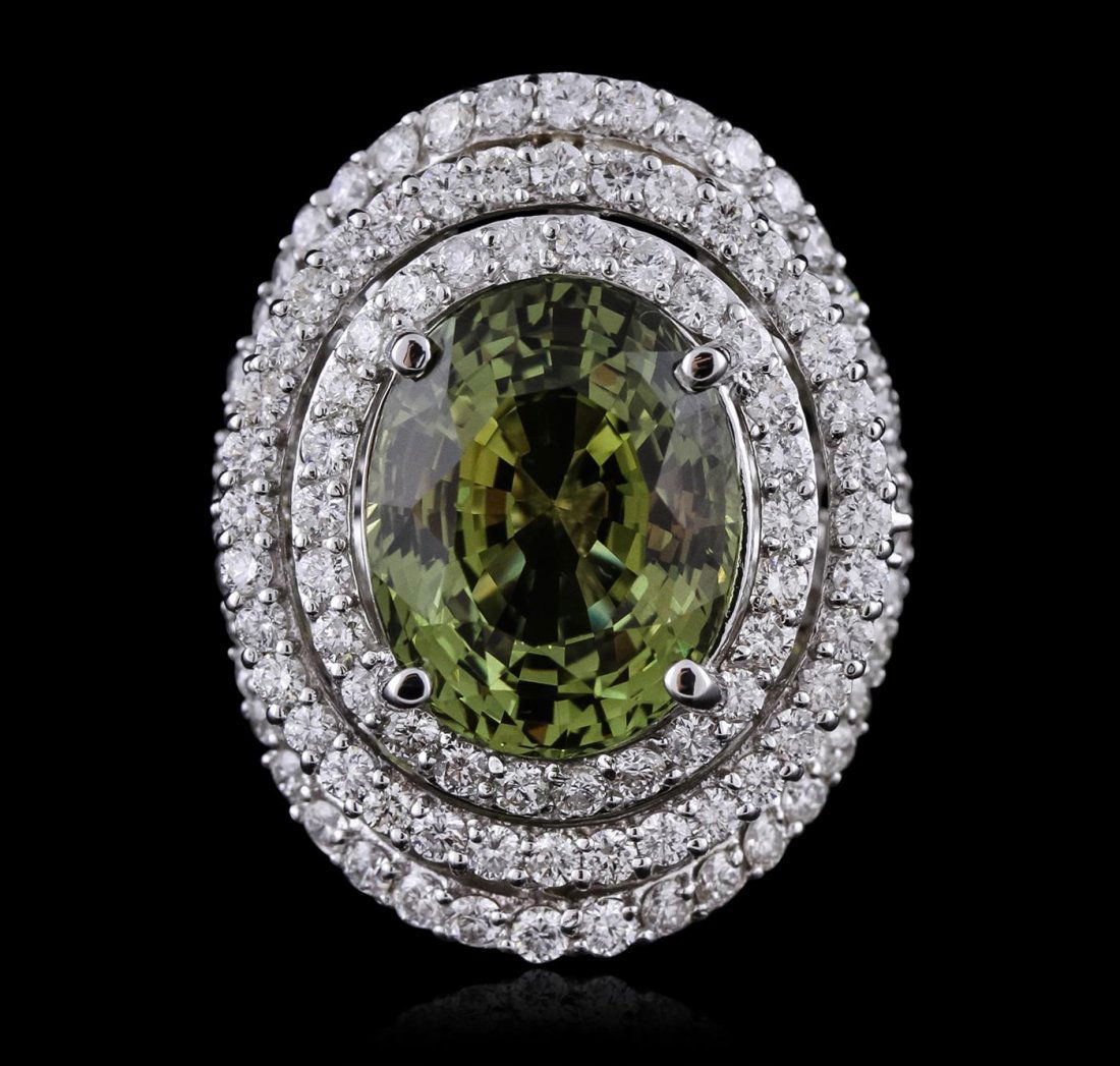 14KT White Gold GIA Certified 11.61ct Alexandrite and: One electronically tested 14KT white gold ladies cast alexandrite and diamond ring with a bright polish finish. Condition is new, good workmanship. The featured alexandrite is set within multiple diam