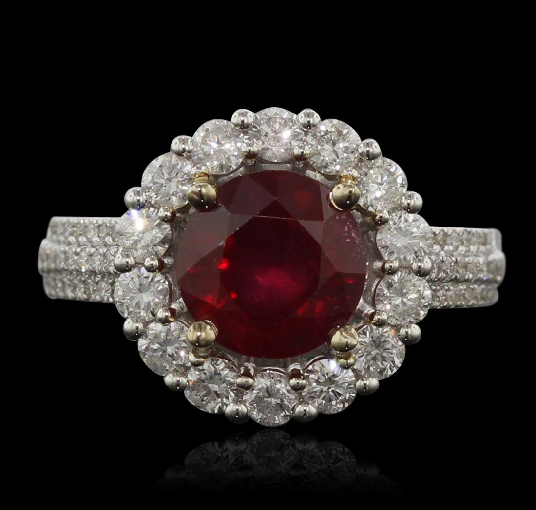 14KT White Gold 3.24ct Ruby and Diamond Ring: One electronically tested 14KT white gold ladies cast ruby and diamond ring with a bright polish finish. Condition is new, good workmanship. The featured ruby is set within a diamond bezel supported b