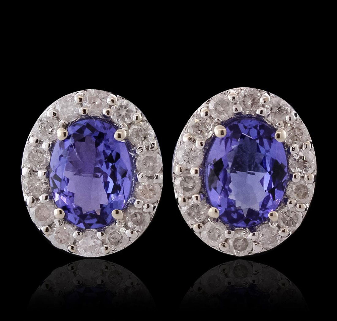 14KT White Gold 2.50ctw Tanzanite and Diamond Earrings: One pair electronically tested 14KT white gold ladies cast & assembled tanzanite & diamond earrings with standard backs. Each earing features a tanzanite set within a diamond bezel. Trademark is Orian