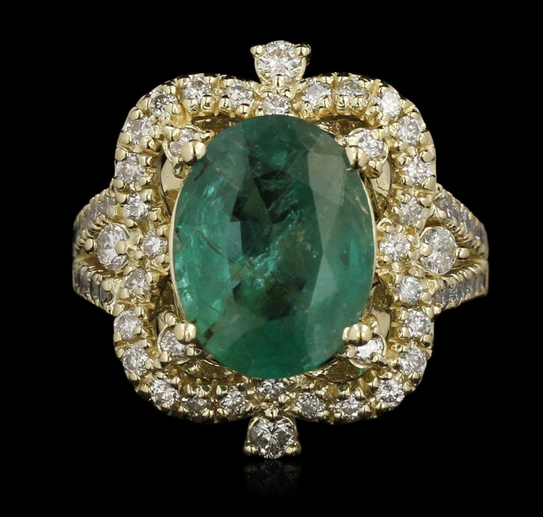 14KT Yellow Gold 3.65ct Emerald and Diamond Ring: One electronically tested 14KT Yellow Gold ladies cast emerald and diamond ring with a bright polish finish. Condition is new, good workmanship. The featured emerald is set within an elaborate diamond