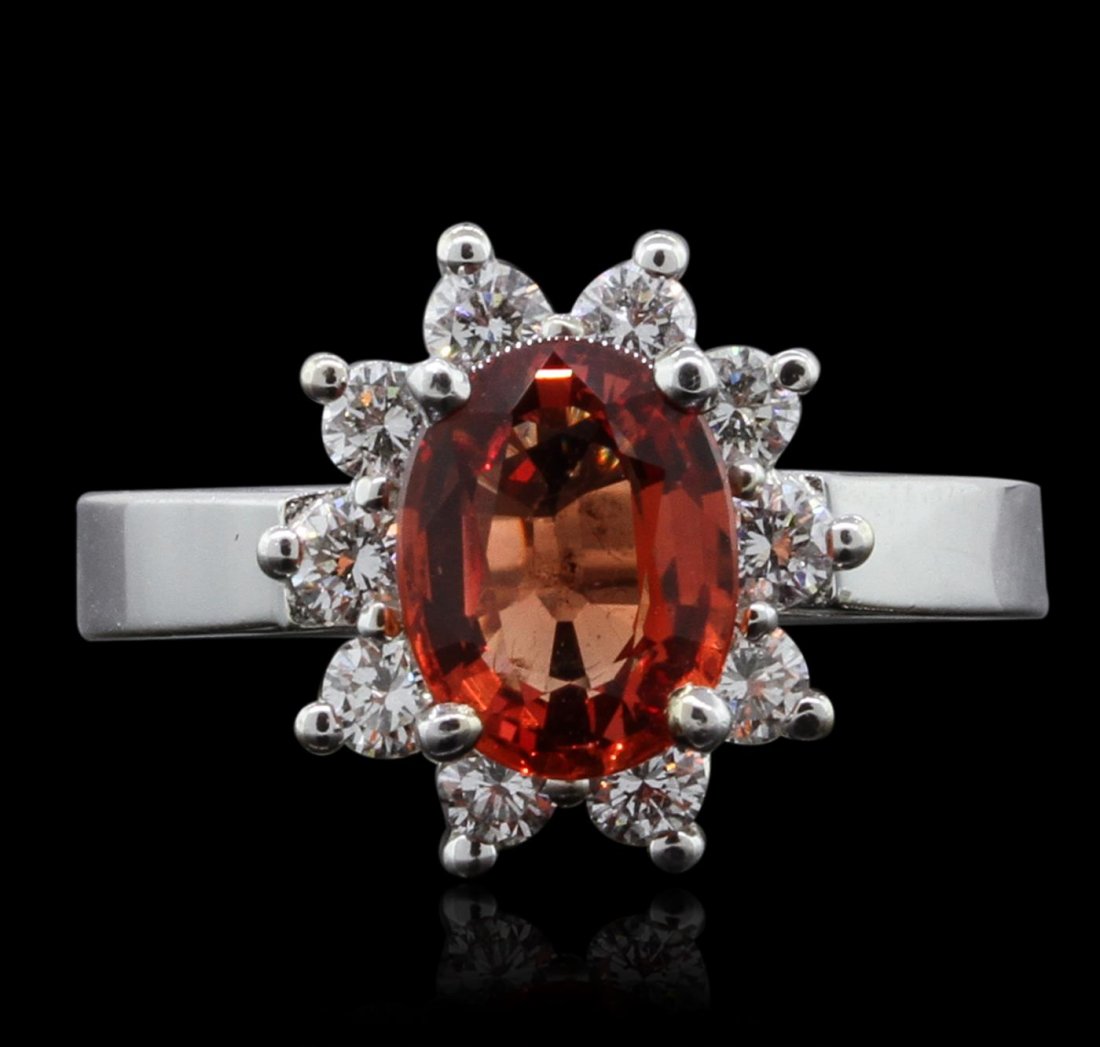 14KT White Gold 2.24ct Orange Sapphire and Diamond Ring: One electronically tested 14KT white gold lady's combination cast & assembled ring with a bright polish finish. Identified with markings of "14K". Condition is new. Containing: One prong set oval modi
