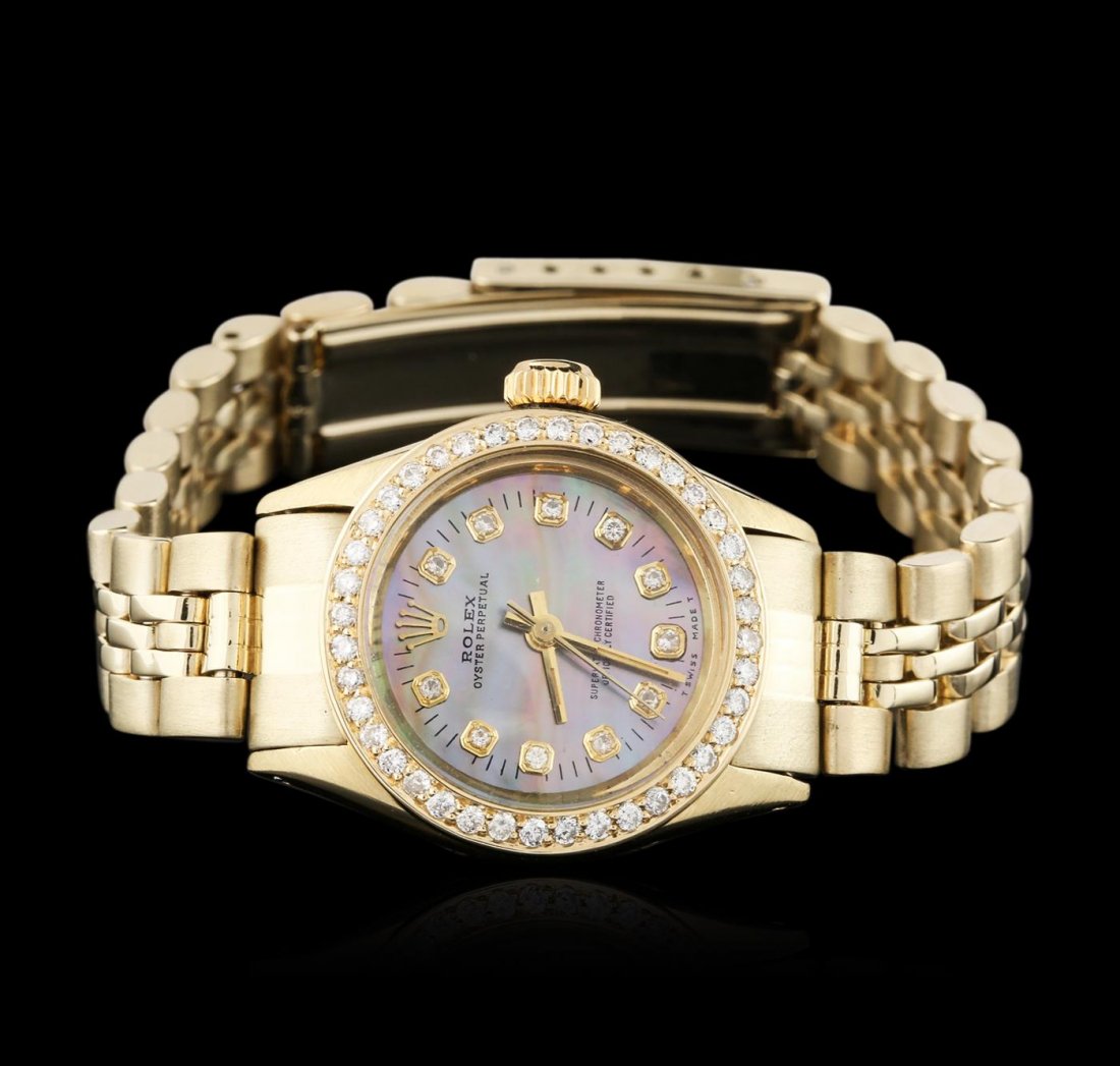 Ladies Rolex 14KT Yellow Gold Diamond Oyster Perpetual: One ladies, hand crafted & machine milled Rolex Oyster Perpetual, model wristwatch electronically tested 14KT yellow gold, Circa: 1978, Case: 25mm oyster, Crown: twinlock with logo, Custom Bezel: diam