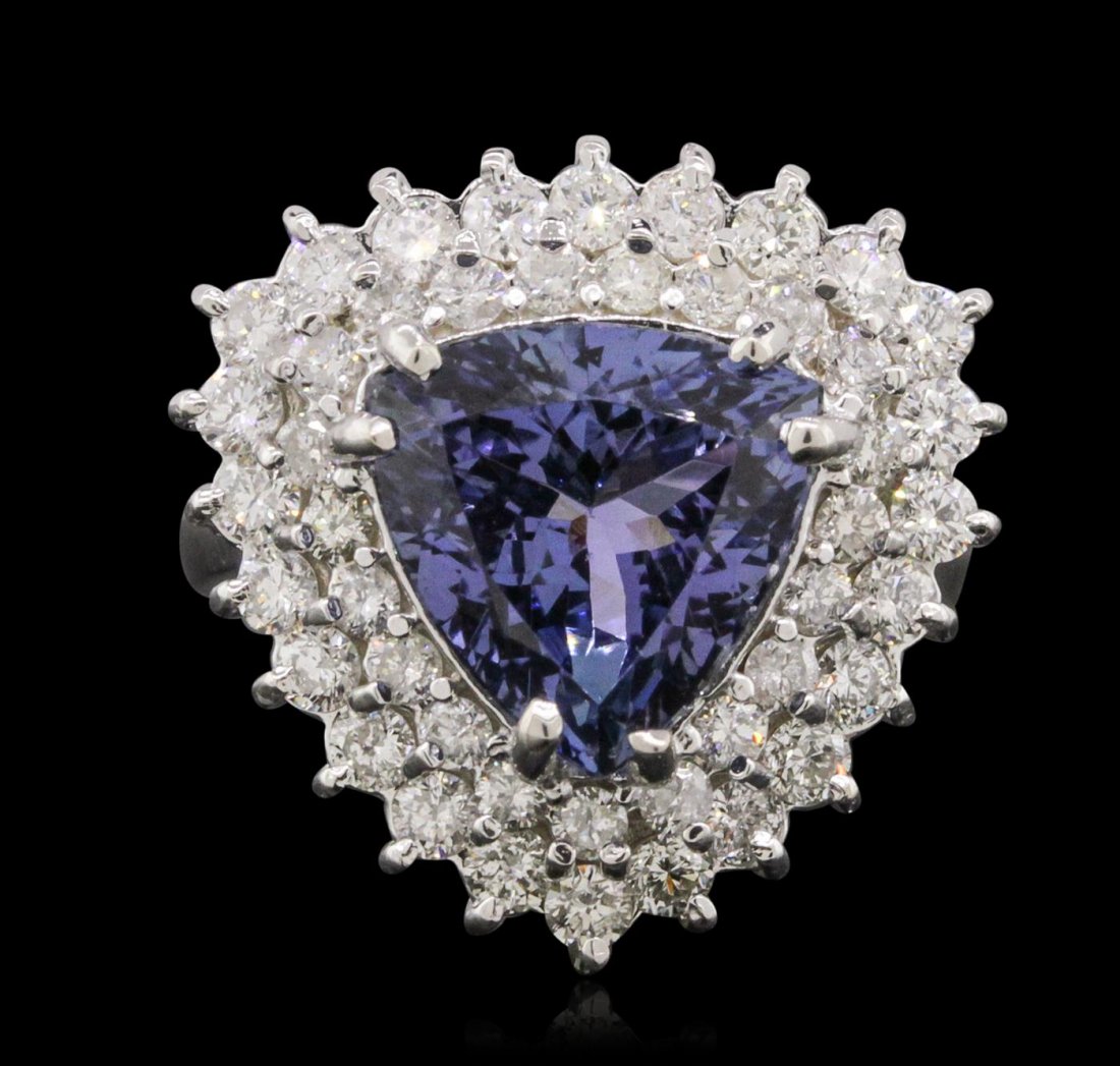 14KT White Gold 4.56ct Tanzanite and Diamond Ring: One electronically tested 14KT white gold ladies combination cast & assembled ring with a bright polish finish. Condition is new. Identified with markings of "K14". Containing: One prong set triangle 