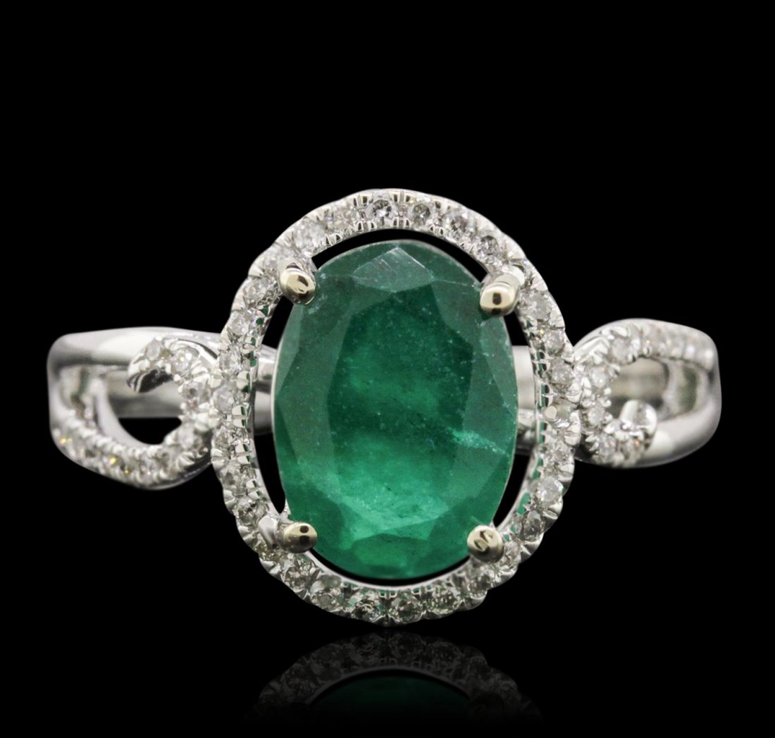 14KT White Gold 2.07ct Emerald and Diamond Ring: One electronically tested 14KT white gold ladies cast emerald and diamond ring with a bright polish finish. Condition is new, good workmanship. The featured emerald is set within a diamond bezel suppo