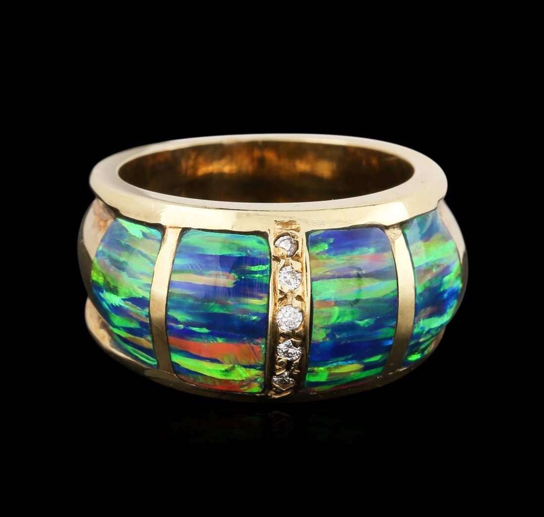 14KT Yellow Gold 0.04ctw Diamond and Opal Ring: One electronically tested 14KT yellow gold ladies cast opal and diamond ring with a bright polish finish. Identified with markings of "14K". Condition is new. Containing: Five prong set round brillian