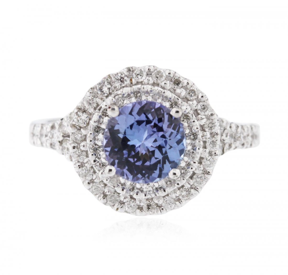 14KT White Gold 1.84ct Tanzanite and Diamond Ring: One electronically tested 14KT white gold ladies cast tanzanite and diamond ring with a bright polish finish. Identified with markings of "K14". Condition is new. Containing: One prong set round modif