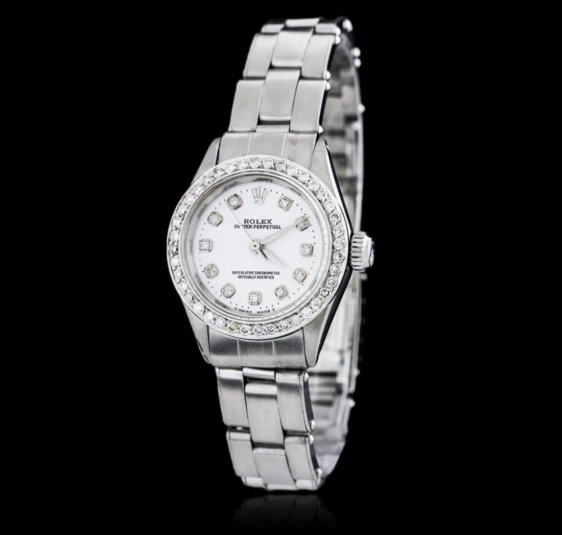 Ladies Rolex Stainless Steel Diamond Oyster Perpetual: One ladies, hand crafted & machine milled Rolex Oyster Perpetual Model stainless steel wristwatch electronically tested, Case: 25mm oyster, Crown: twinlock with logo, Custom Bezel: diamond set, Custom
