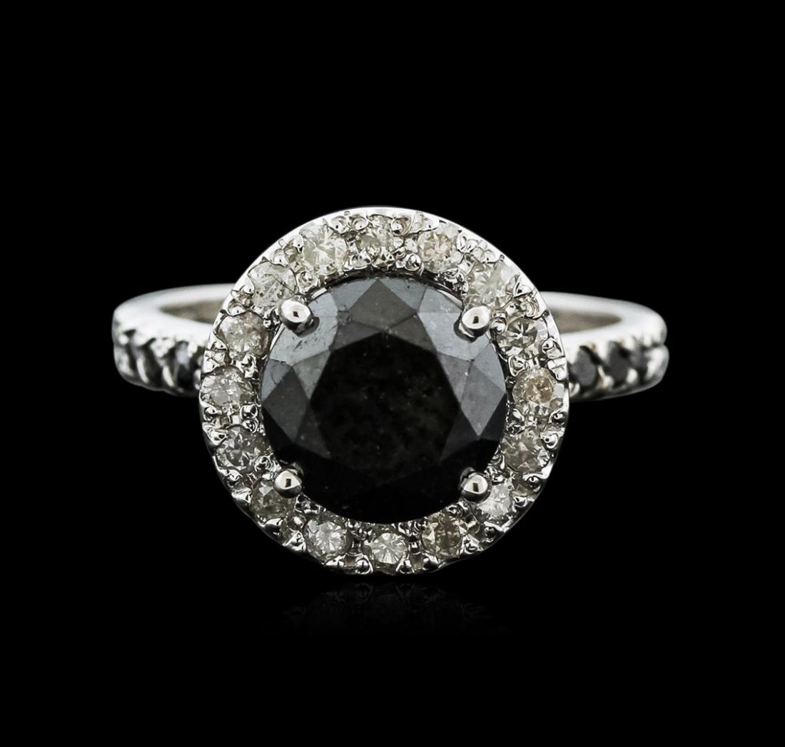 14KT White Gold 5.23ctw Black Diamond Ring: One lady's polished, stamped and electronically tested solid 14k white gold ring mounted with: 1 Genuine Black Diamond, 16 Genuine Diamonds and 22 Genuine Black Diamonds. This item weighs 5.90 grams a