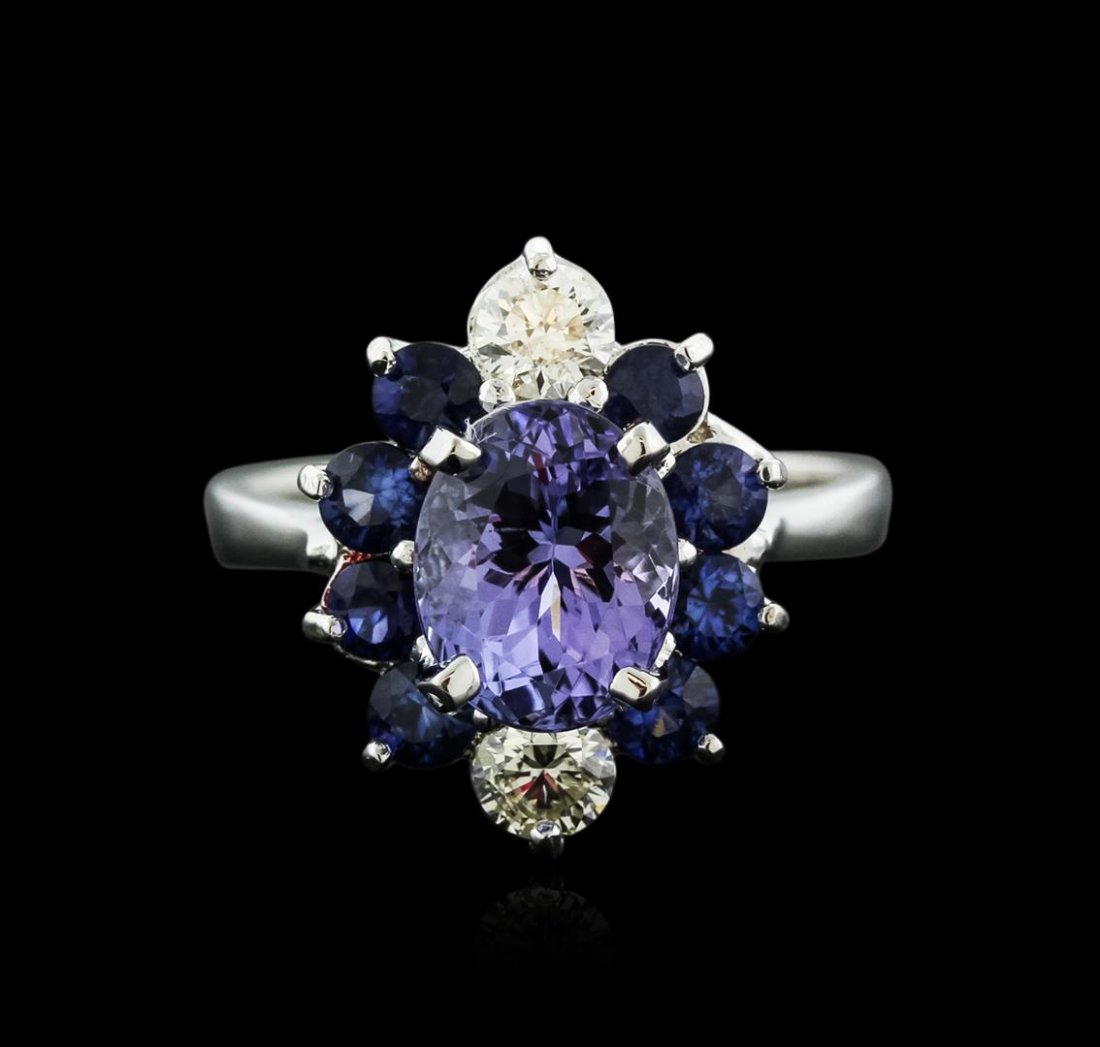 14KT White Gold 1.90ct Tanzanite, Sapphire and Diamond: One electronically tested 14KT white gold ladies cast tanzinite, sapphire and diamond ring with a bright polish finish. Identified with markings of "K14". Condition is new. Containing: One prong set o