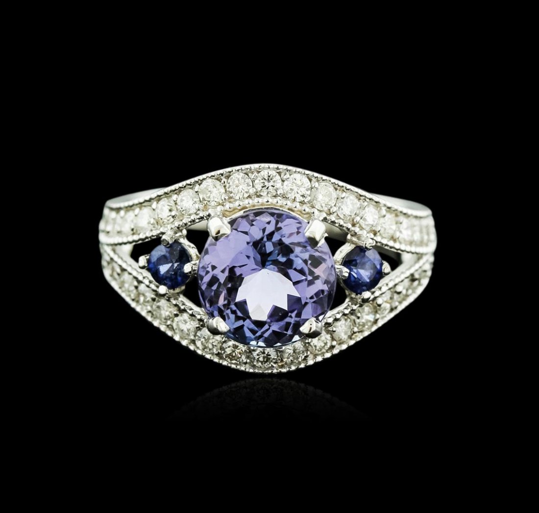 14KT White Gold 2.58ct Tanzanite, Sapphire and Diamond: One electronically tested 14KT white gold ladies cast tanzinite, sapphire and diamond ring with a bright polish finish. Identified with markings of "K14". Condition is new. Containing: One prong set r