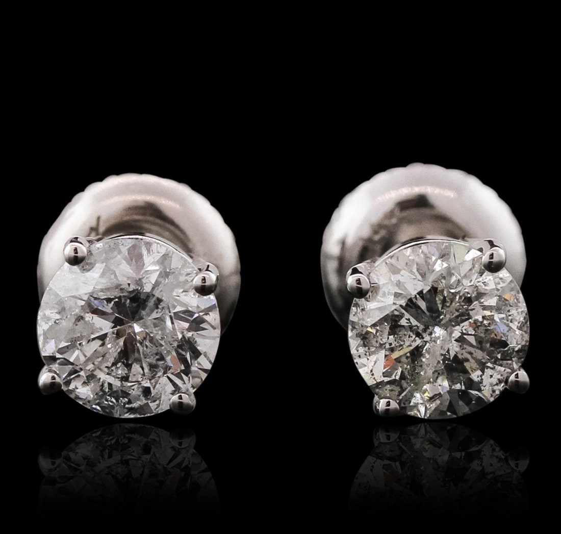 14KT White Gold 1.57ctw Diamond Solitaire Earrings: One pair electronically tested 14KT white gold cast & assembled diamond solitaire earrings with screw backs. Bright polish finish. Condition is new, good workmanship. Containing: One prong set round b