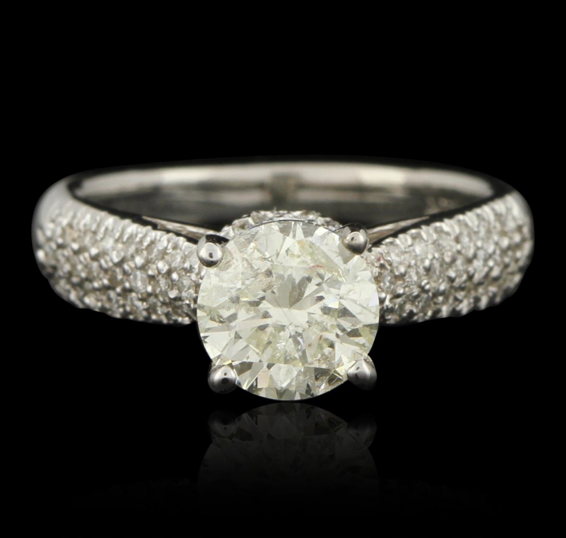 14KT White Gold 1.54ct I-1/ Light Yellow Diamond Ring: One electronically tested 14KT white gold ladies cast & assembled diamond unity ring with a bright polish finish. Condition is good. The featured diamond is cathedral set within diamond set shoulders,