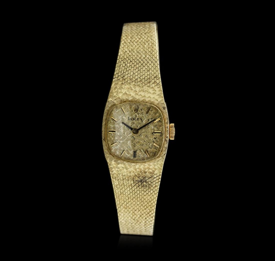 Ladies Rolex 14KT Yellow Gold Wristwatch: One ladies, Rolex wristwatch electronically tested 14KT yellow gold, Case: 18.00mm x 17.00mm, Closed Case Back, Crown: logo'd, Crystal: acrylic, Rolex Movement: eighteen jewel Swiss unadjusted mechani