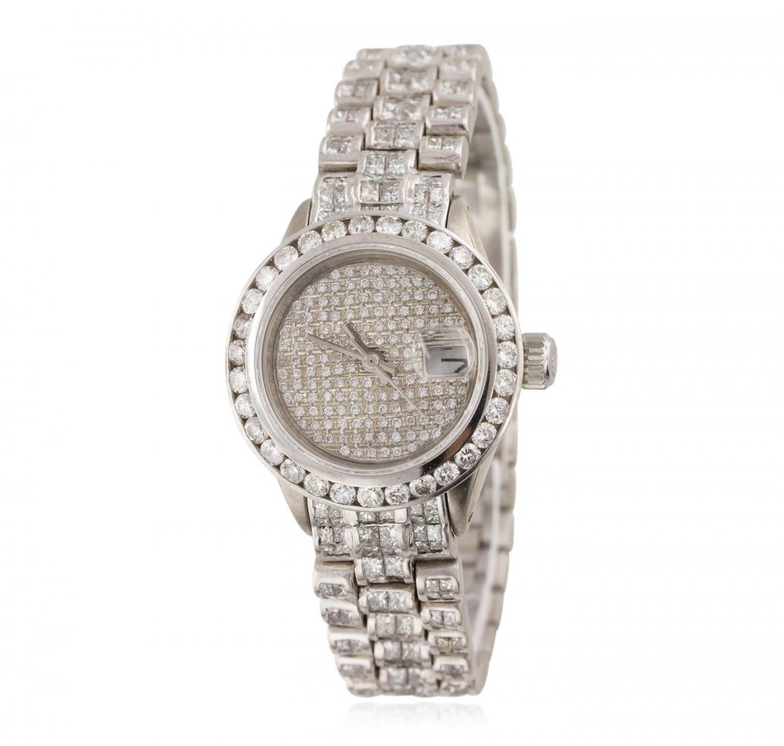 Ladies Rolex 18KT White Gold 10.80ctw Diamond DateJust: One ladies, Rolex Lady President, the DateJust model wristwatch electronically tested 18KT white gold, Case: 26mm oyster, Crown: twin lock with logo, Custom Bezel: diamond set, Custom Crystal: synthet