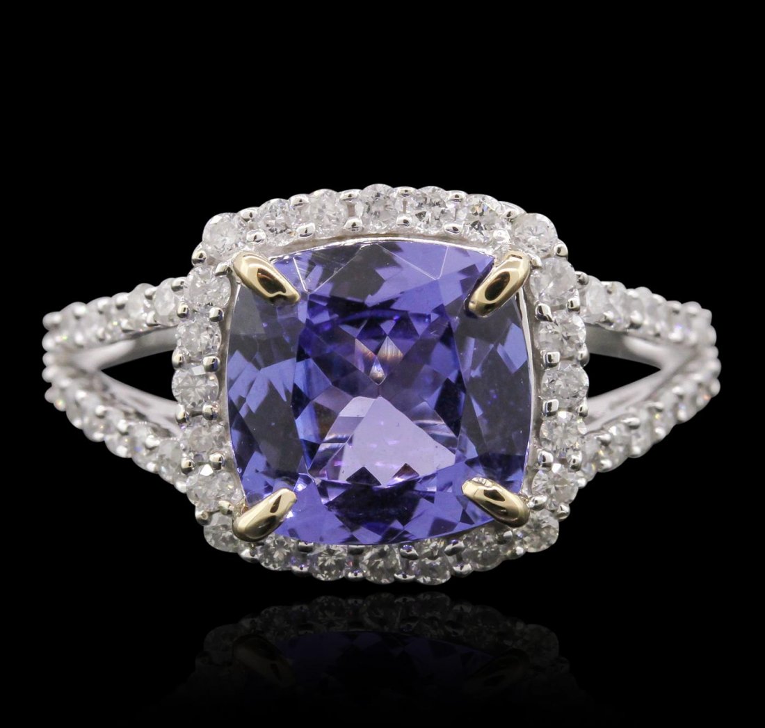 14KT White And Yellow Gold 2.75ct Tanzanite and Diamond: One electronically tested 14KT white and yellow gold Ladies cast ring with a bright polish finish. Condition is new. Identified with markings of "14K". Containing: One prong set square cushion modifie