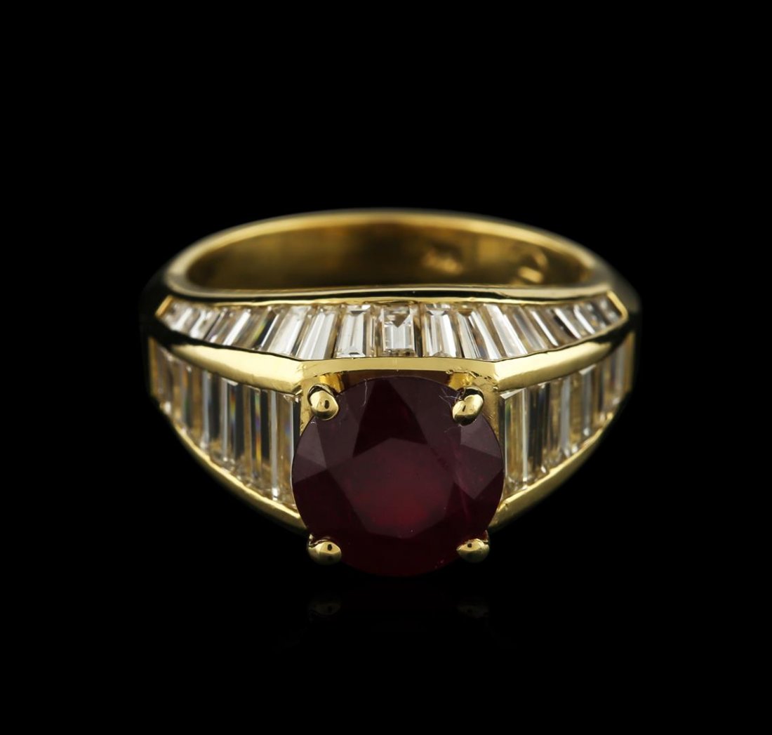 18KT Yellow Gold 3.20ct Ruby and Diamond Ring: One electronically tested 18KT yellow gold ladies cast ruby and diamond ring with a bright polish finish. Identified with markings of "18K". Condition is new. Containing: One prong set round modified 