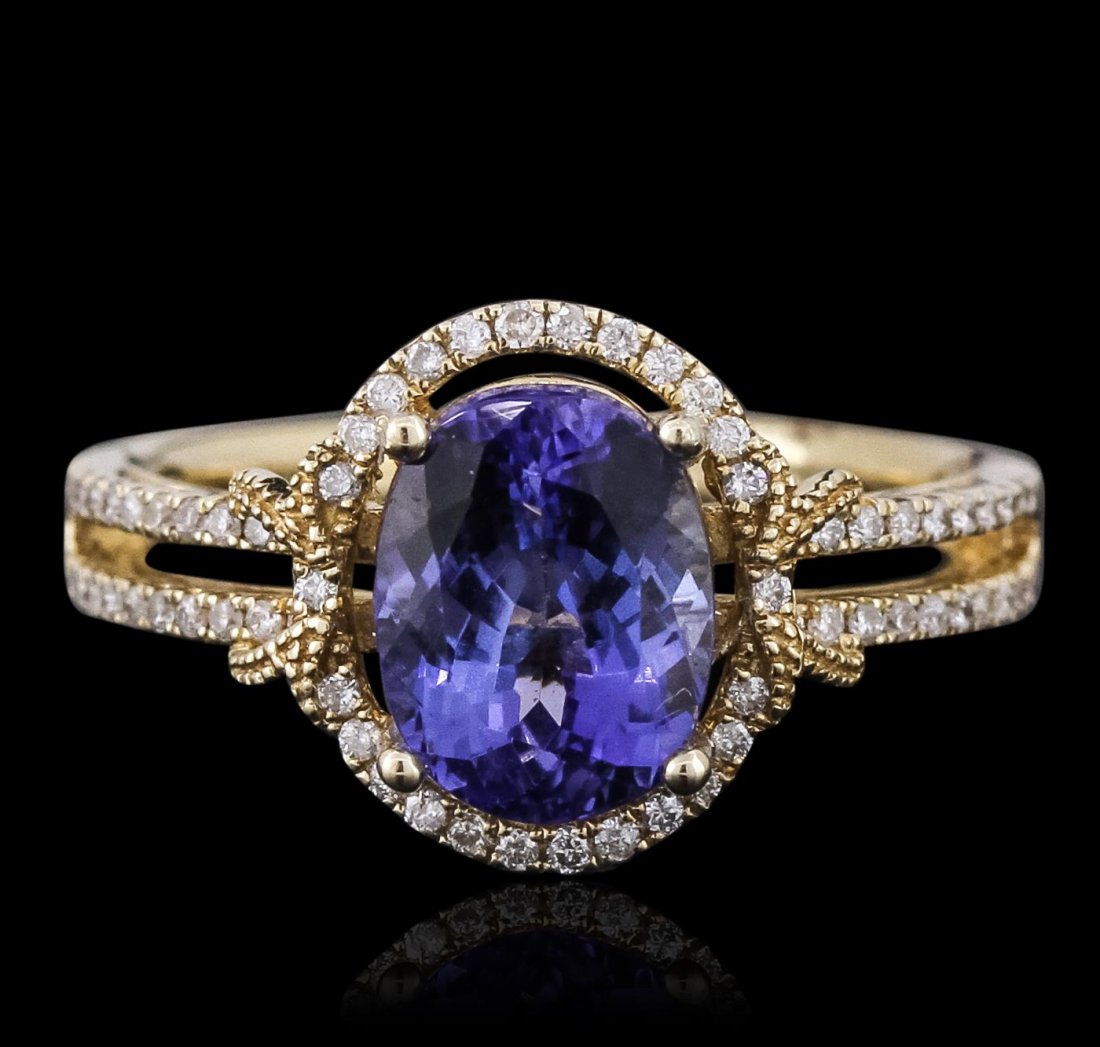 14KT Yellow Gold 2.29ct Tanzanite and Diamond Ring: One electronically tested 14KT yellow gold ladies combination cast & assembled ring with a bright polish finish. Condition is new. Identified with markings of "14K". Containing: One prong set oval mod