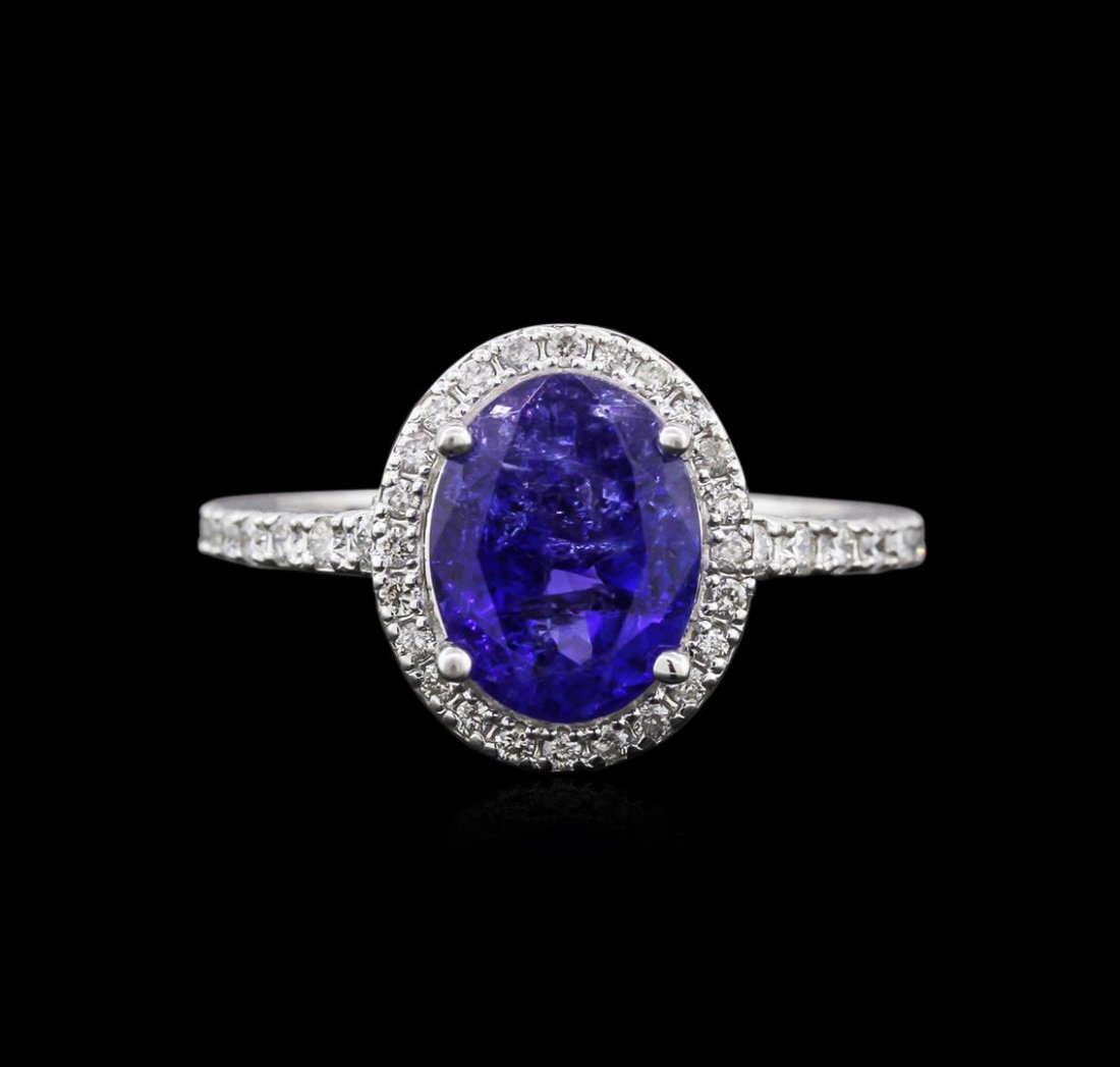 14KT White Gold 3.00ct Tanzanite and Diamond Ring: One electronically tested 14KT white gold ladies cast tanzanite and diamond ring with a bright polish finish. Identified with markings of "K14". Condition is new. Containing: One prong set oval modifi