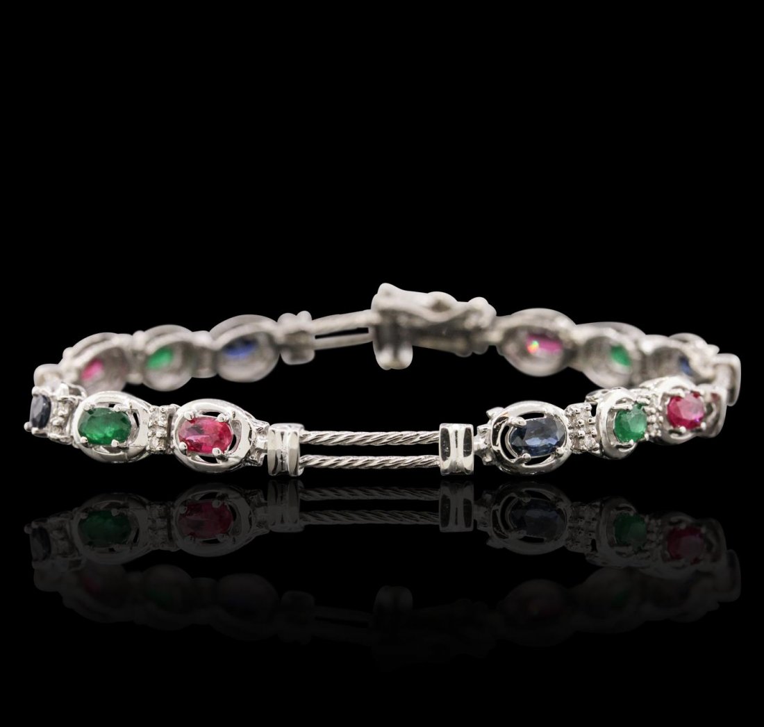 14KT White Gold 1.72ctw Multi Gemstone Bracelet: One Bracelet featuring: 14KT White Gold with a total weight of 9.80 grams, Emeralds with a total weight of 1.72ctw, Rubies with a total weight of 1.72ctw, Sapphires with a total weight of 1.72ctw, and
