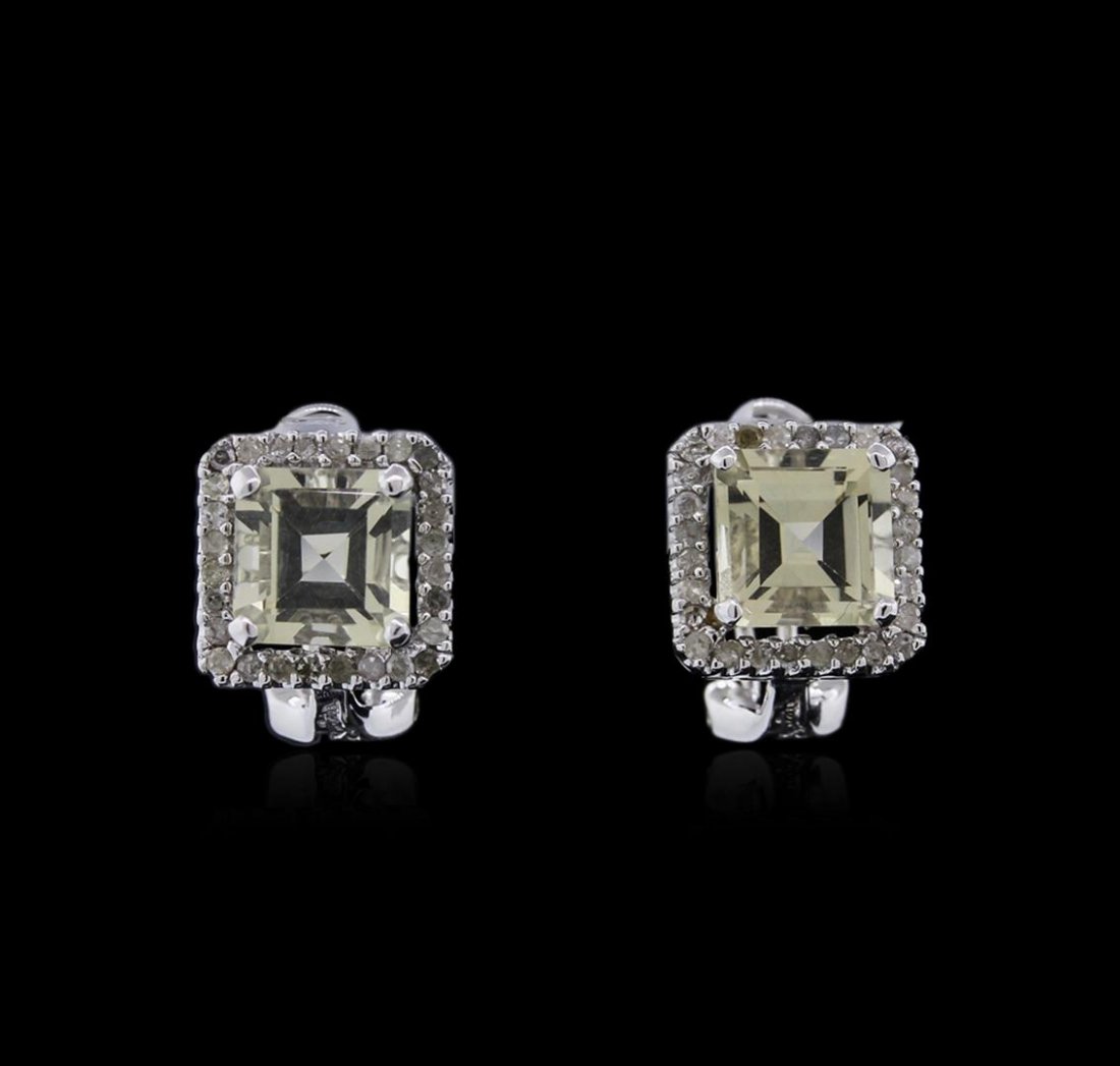 14KT White Gold 3.08ctw Lemon Quartz and Diamond: One pair of earrings featuring: 14KT white gold weighing 4.24 grams containing two lemon quartz with a total weight of 3.08ct and diamonds with a total weight of 0.39ct.