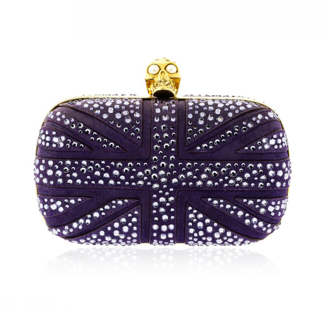 Alexander McQueen Purple Suede Jewel Embroidered Clutch: One Alexander McQueen Purple Suede Jewel Embroidered Clutch. This elegant clutch features purple suede with polished gold tone hardware, jewel embroidered body with skull details on top, button closur