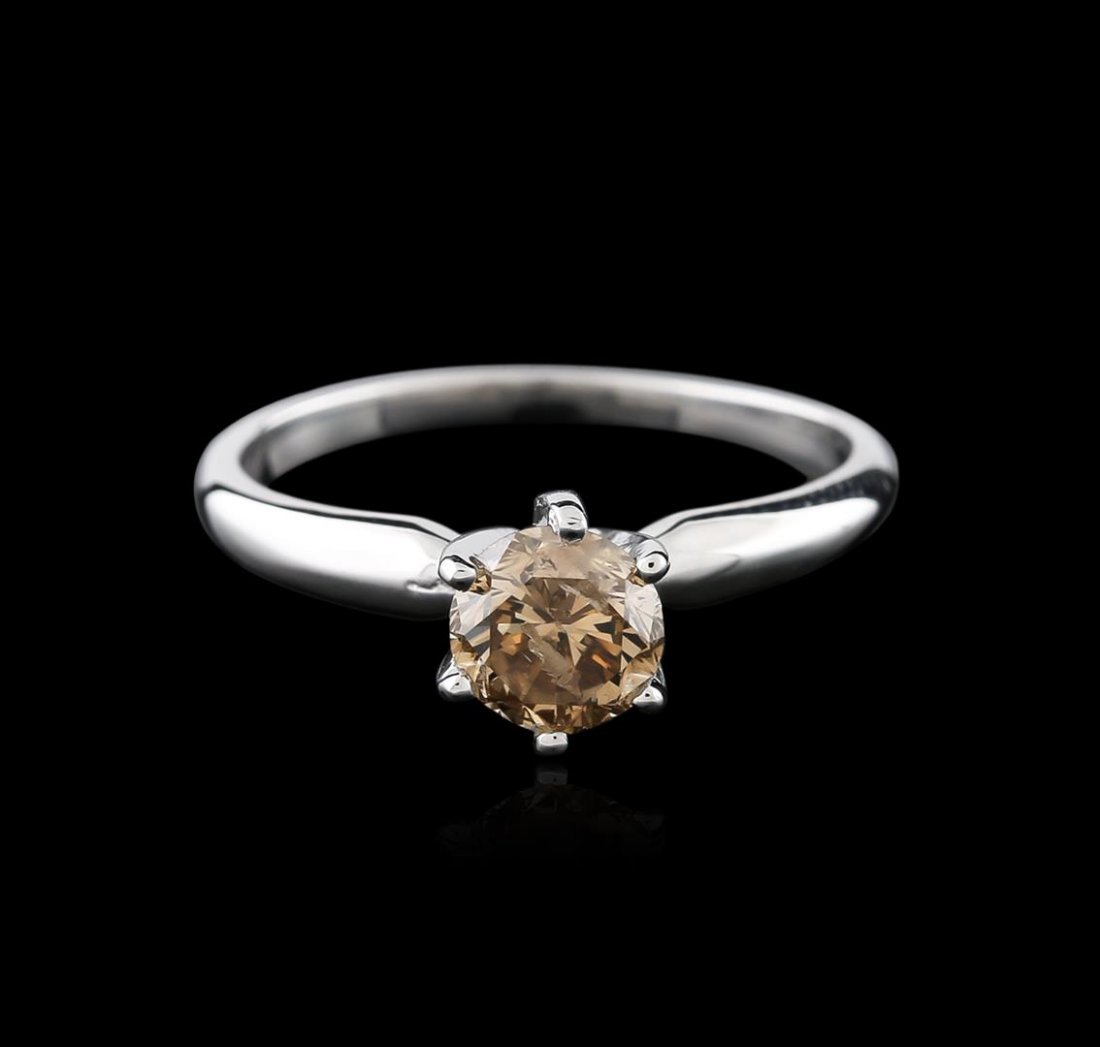 14KT White Gold 0.80ct Round Cut Fancy Brown Diamond: One electronically tested 14KT white gold ladies cast diamond solitaire ring with a half round shank with a bright polish finish. Identified with markings of "14K". Condition is new. Containing: One p
